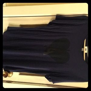 A dark blue shirt with a heart in the center
